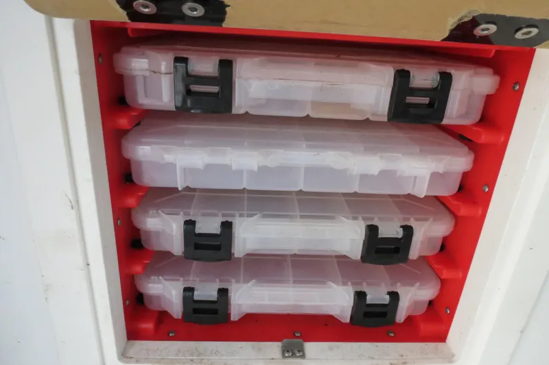 Slide: The Image of Tackle storage compartment on 2018 Parker 2520 XLD Sport Cabin boat. - 37