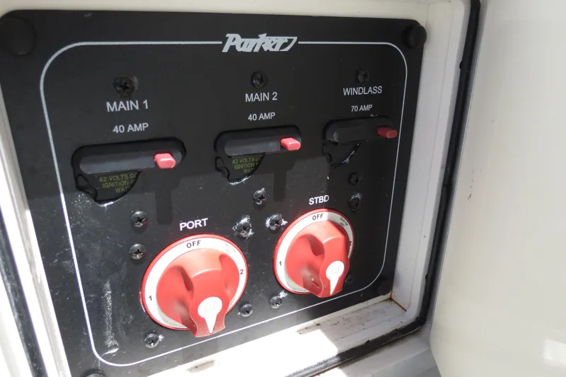 Slide: The Image of Control panel of a 2018 Parker 2520 XLD Sport Cabin boat with switches and dials. - 39