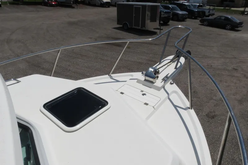 Slide: The Image of 2018 Parker 2520 XLD Sport Cabin boat deck with anchor and hatch. - 42