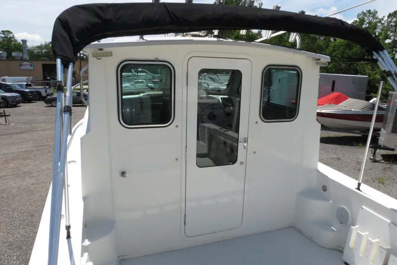 Slide: The Image of 2018 Parker 2520 XLD Sport Cabin boat, rear view of cabin and deck. - 48