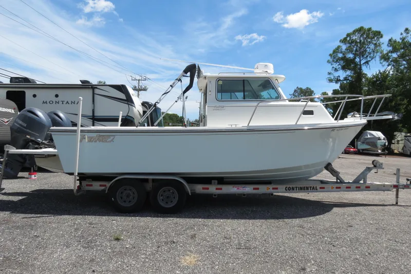 Slide: The Image of 2018 Parker 2520 XLD Sport Cabin boat on a Continental trailer. - 7