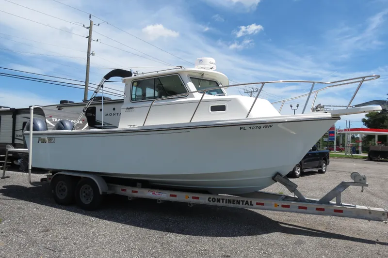 Slide: The Image of 2018 Parker 2520 XLD Sport Cabin boat on a Continental trailer. - 8