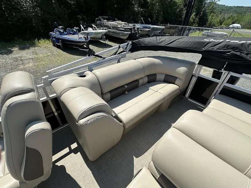 Slide: The Image of 2021 Sun Tracker PB 22 RF pontoon boat with beige seating and spacious deck. - 12