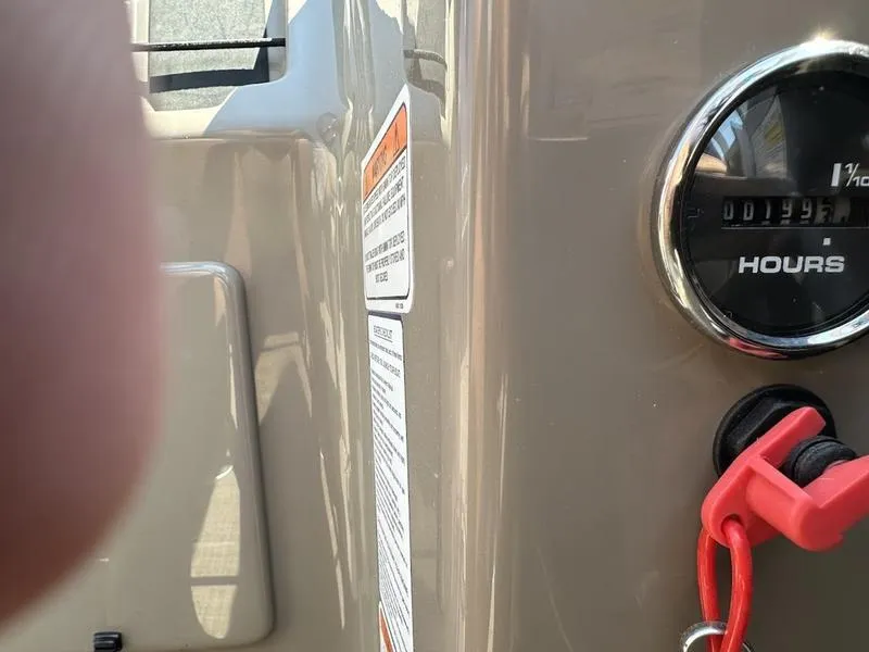 Slide: The Image of Close-up of 2021 Sun Tracker PB 22 RF dashboard with hour meter and safety lanyard. - 4