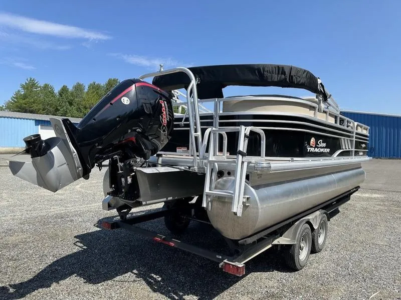 Slide: The Image of 2021 Sun Tracker PB 22 RF pontoon boat on trailer, outdoor setting. - 5