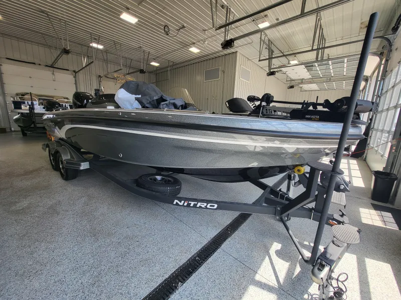 Slide: The Image of 2018 Nitro ZV21 boat in a showroom, side view. - 0