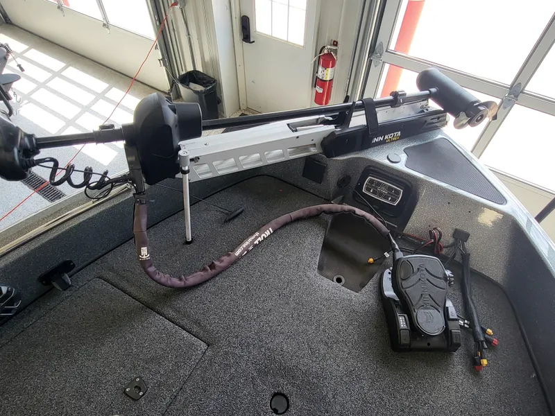 Slide: The Image of 2018 Nitro ZV21 boat with Minn Kota trolling motor in garage. - 4