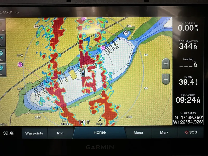 Slide: The Image of Garmin GPS display showing nautical chart with depth and coordinates for Bayliner 3288, 1992 model. - 13