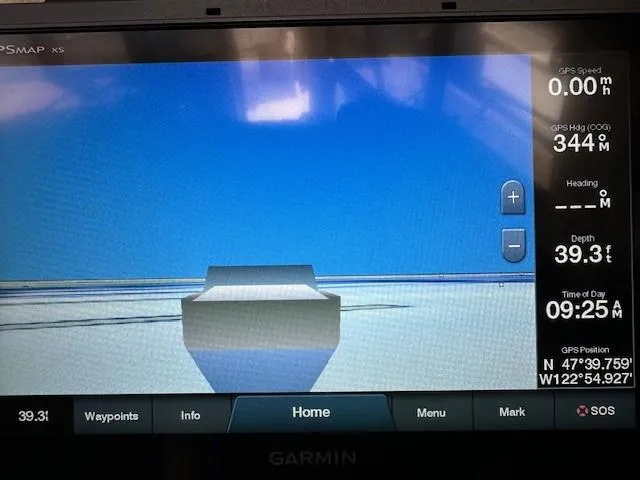 Slide: The Image of Garmin GPS display on a 1992 Bayliner 3288, showing navigation data and coordinates. - 14