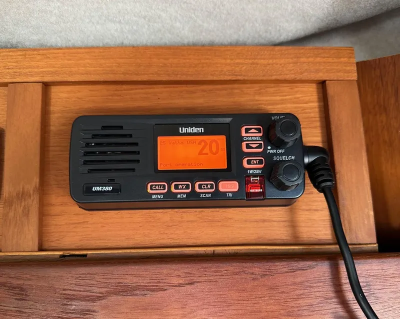 Slide: The Image of Uniden UM380 marine radio on 1992 Bayliner 3288 boat, mounted on wooden panel. - 15