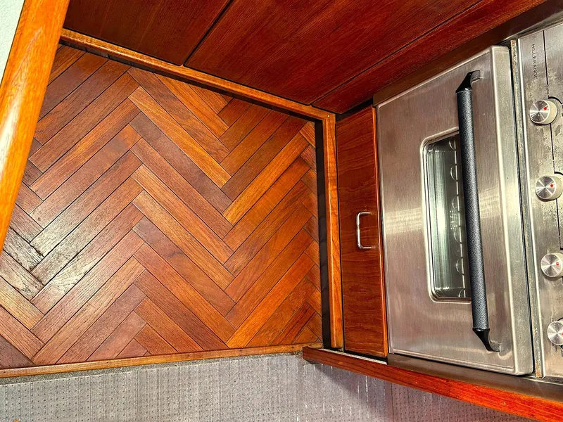 Slide: The Image of 1992 Bayliner 3288 kitchen with herringbone wood floor and stainless steel oven. - 19