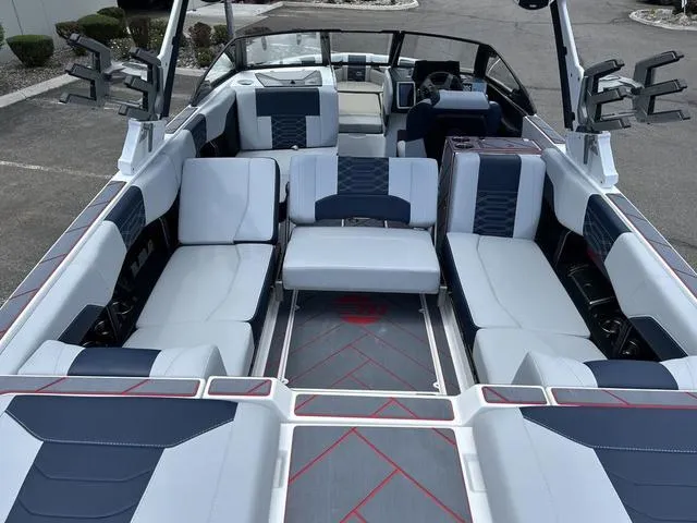 Slide: The Image of 2024 Malibu 25 LSV boat interior with spacious seating and modern design. - 6
