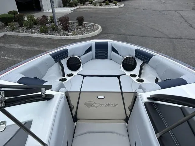 Slide: The Image of 2024 Malibu 25 LSV boat interior with spacious seating and premium audio system. - 7