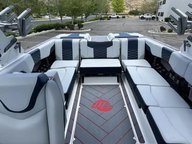 Slide: The Image of 2024 Malibu 25 LSV boat interior with spacious seating and modern design. - 9