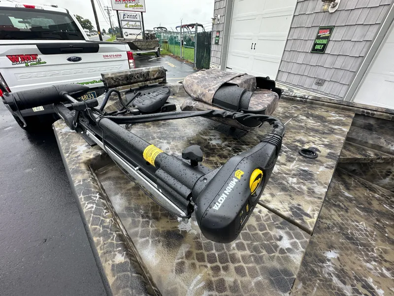 Slide: The Image of 2025 Excel 1960 Stalker CC boat with Minn Kota trolling motor in camouflage pattern. - 12