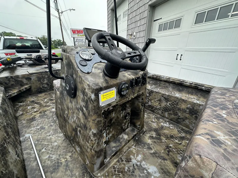 Slide: The Image of Console of 2025 Excel 1960 Stalker CC boat with camouflage design. - 14