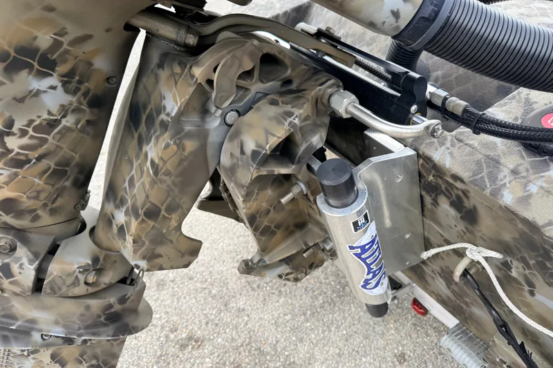 Slide: The Image of Camouflage-patterned mechanical components of a 2025 Excel 1960 Stalker CC boat. - 33