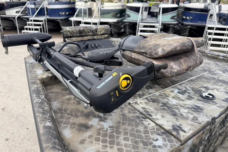 Slide: The Image of Trolling motor on Excel 1960 Stalker CC boat, 2025 model, with camouflage pattern. - 37