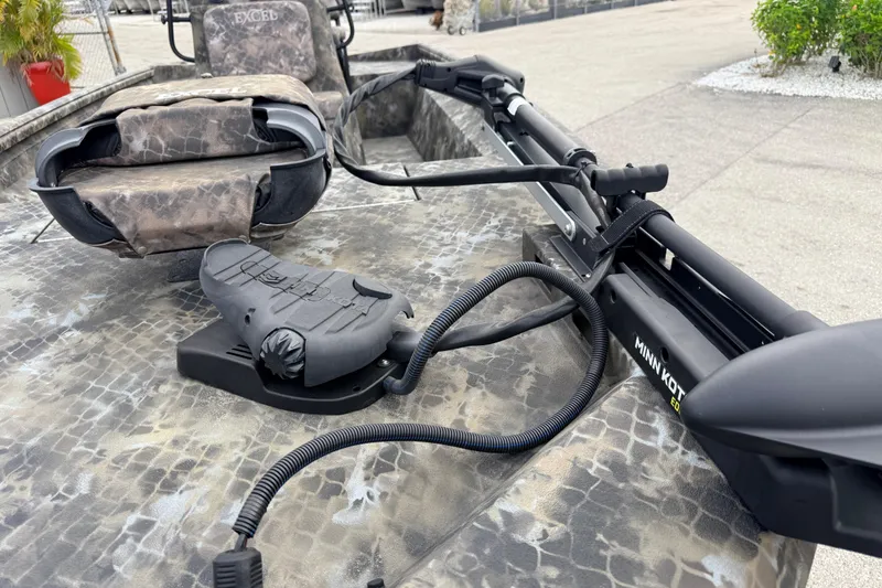 Slide: The Image of 2025 Excel 1960 Stalker CC boat with Minn Kota trolling motor and camo seating. - 38