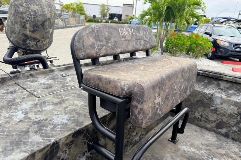 Slide: The Image of 2025 Excel 1960 Stalker CC boat seat with camouflage pattern and logo. - 40