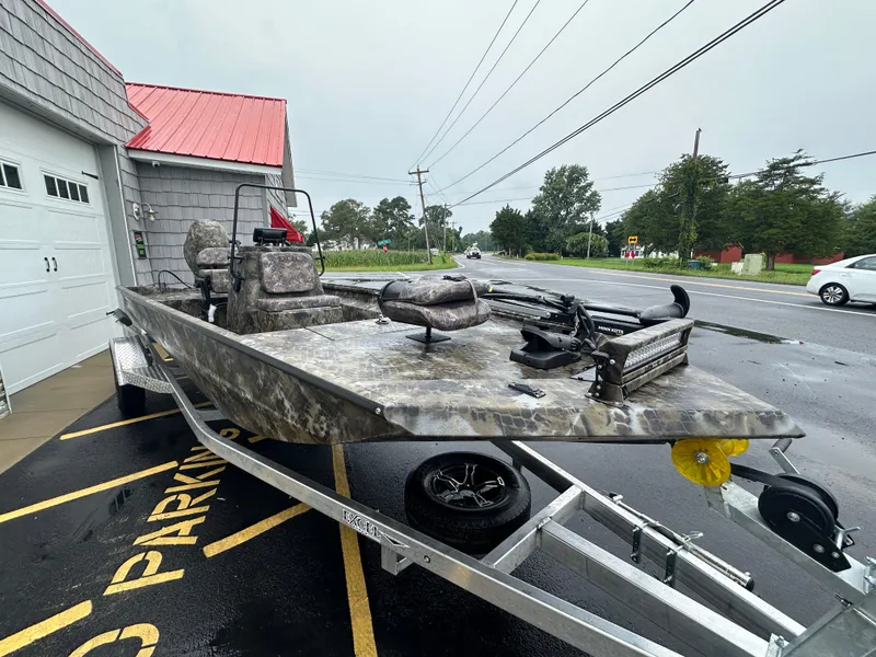 Slide: The Image of 2025 Excel 1960 Stalker CC boat on trailer in parking lot. - 7