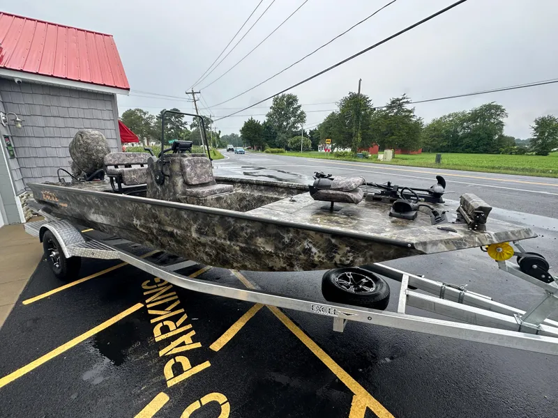 Slide: The Image of 2025 Excel 1960 Stalker CC boat on trailer in parking lot. - 8