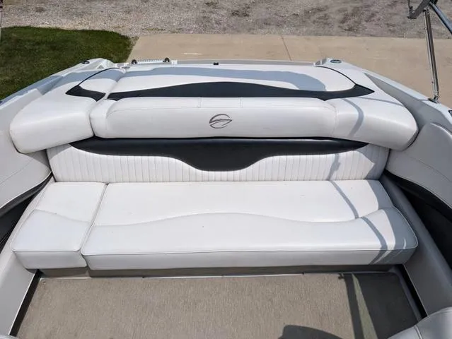 Slide: The Image of 2013 Crownline 21 SS boat interior with white seating and sleek design. - 10