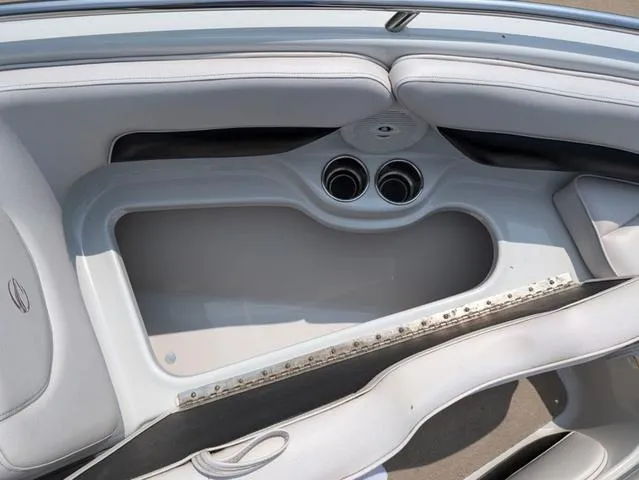 Slide: The Image of 2013 Crownline 21 SS boat interior with cup holders and seating area. - 14