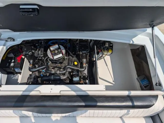 Slide: The Image of 2013 Crownline 21 SS boat engine compartment, showcasing detailed mechanical components. - 19