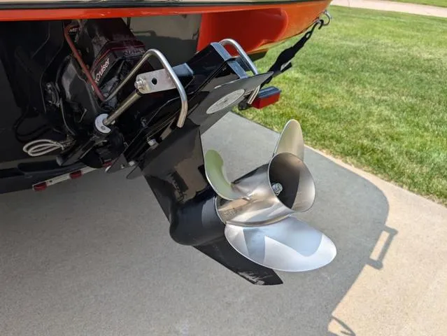 Slide: The Image of 2013 Crownline 21 SS boat propeller and outdrive on concrete surface. - 20