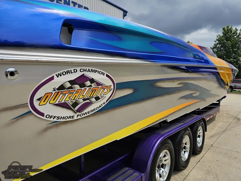 Slide: The Image of 2004 Outerlimits 42 Legacy offshore powerboat on a trailer. - 14