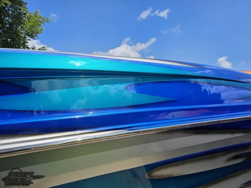 Slide: The Image of Close-up of 2004 Outerlimits 42 Legacy boat with vibrant blue and teal paint. - 20