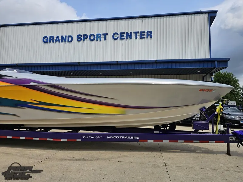 Slide: The Image of 2004 Outerlimits 42 Legacy boat on Myco trailer at Grand Sport Center. - 24
