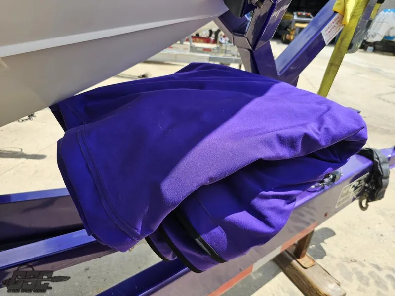 Slide: The Image of 2004 Outerlimits 42 Legacy boat on trailer with purple cover. - 26