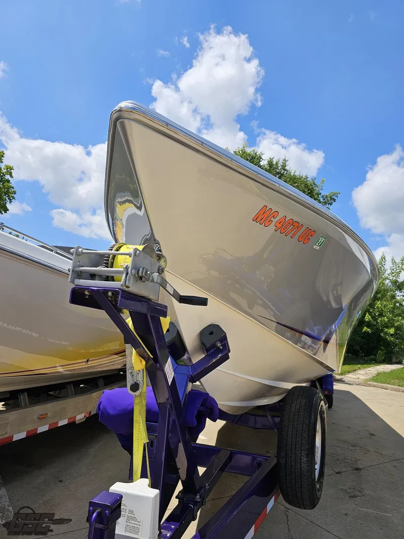 Slide: The Image of 2004 Outerlimits 42 Legacy boat on trailer under a bright blue sky. - 30