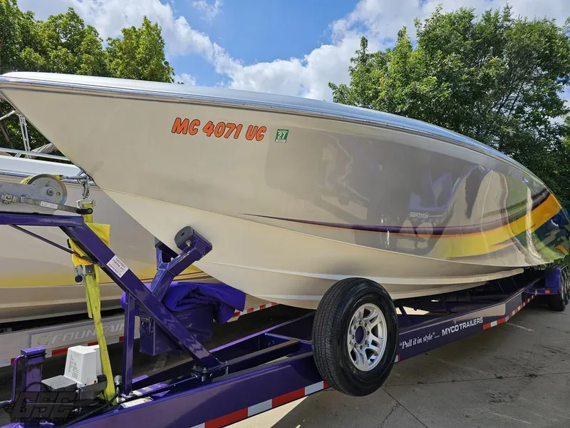 Slide: The Image of 2004 Outerlimits 42 Legacy speedboat on a purple trailer. - 31