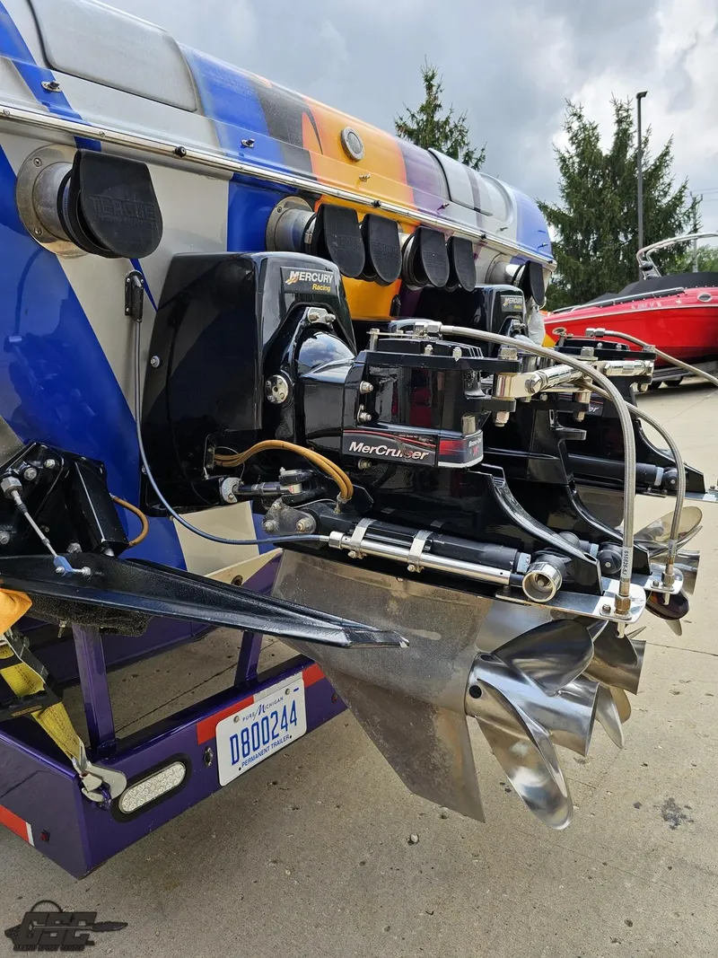 Slide: The Image of Close-up of the 2004 Outerlimits 42 Legacy boat's powerful engine and propeller. - 44