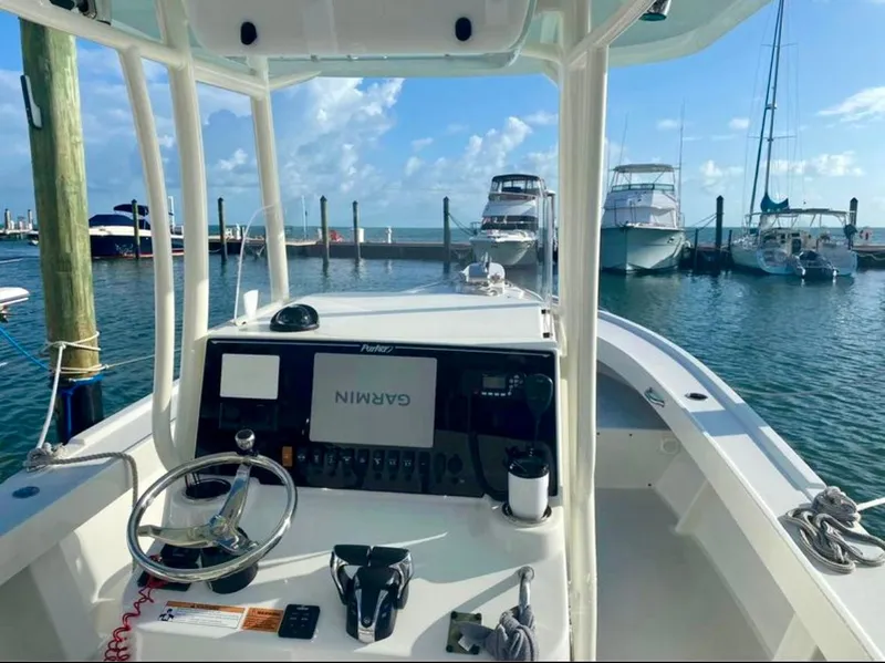 Slide: The Image of 2022 Parker 2801 Center Console boat with Garmin navigation at a marina. - 9