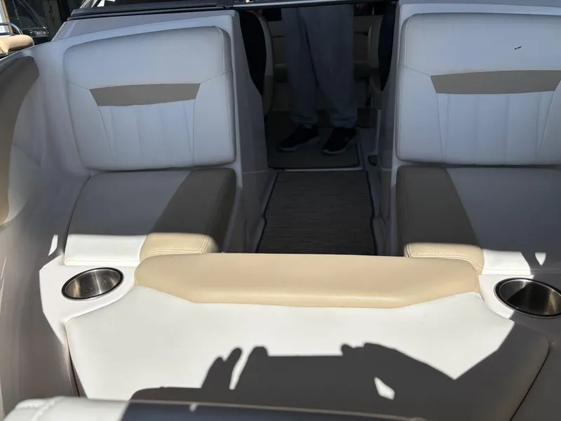 Slide: The Image of Interior of a 2017 Regal 1900 ES boat with white and beige seating. - 11