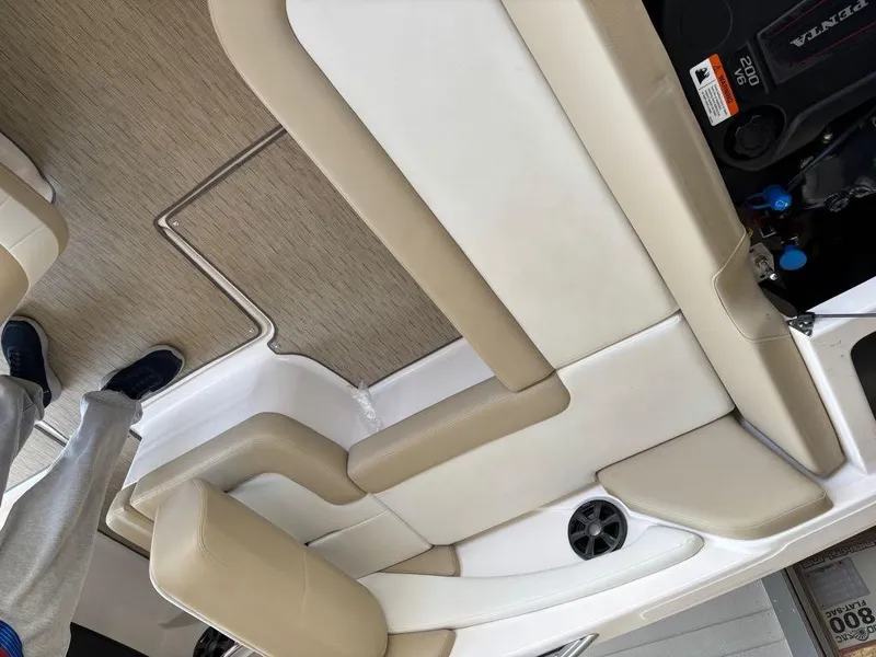 Slide: The Image of Interior of a 2017 Regal 1900 ES boat with beige seating and flooring. - 17