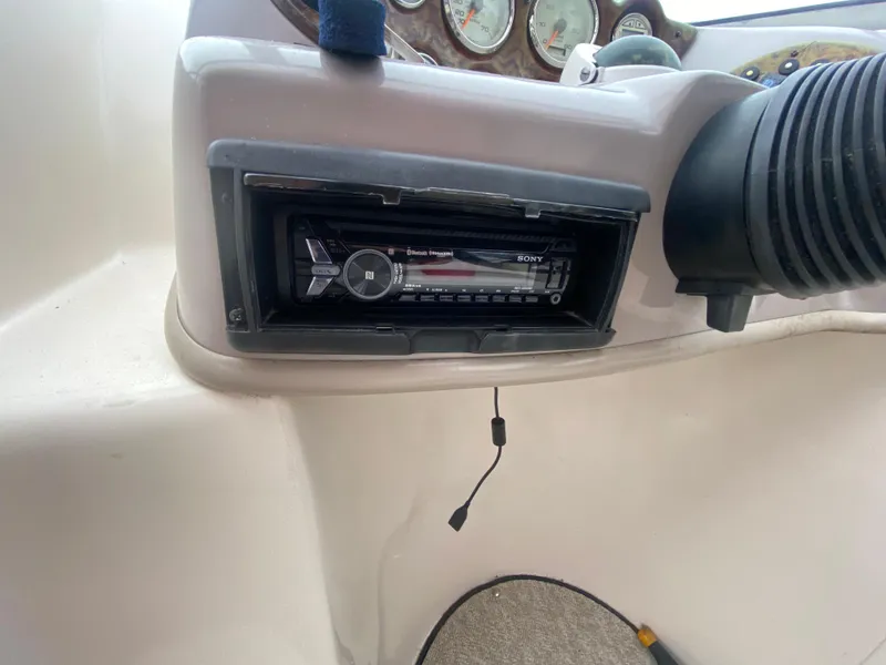 Slide: The Image of 2005 Rinker 232 Captiva Cuddy dashboard with Sony stereo system. - 22