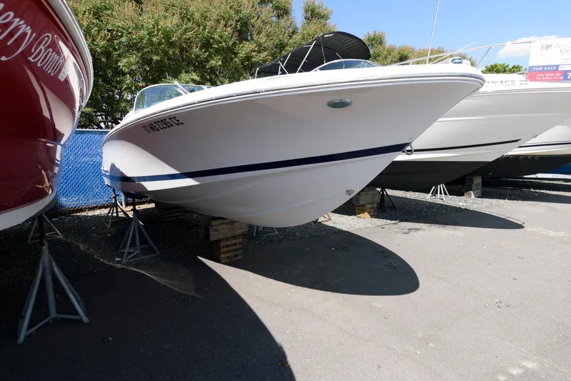 Slide: The Image of 2001 Chris-Craft Launch 22 boat on stands, outdoor storage. - 3