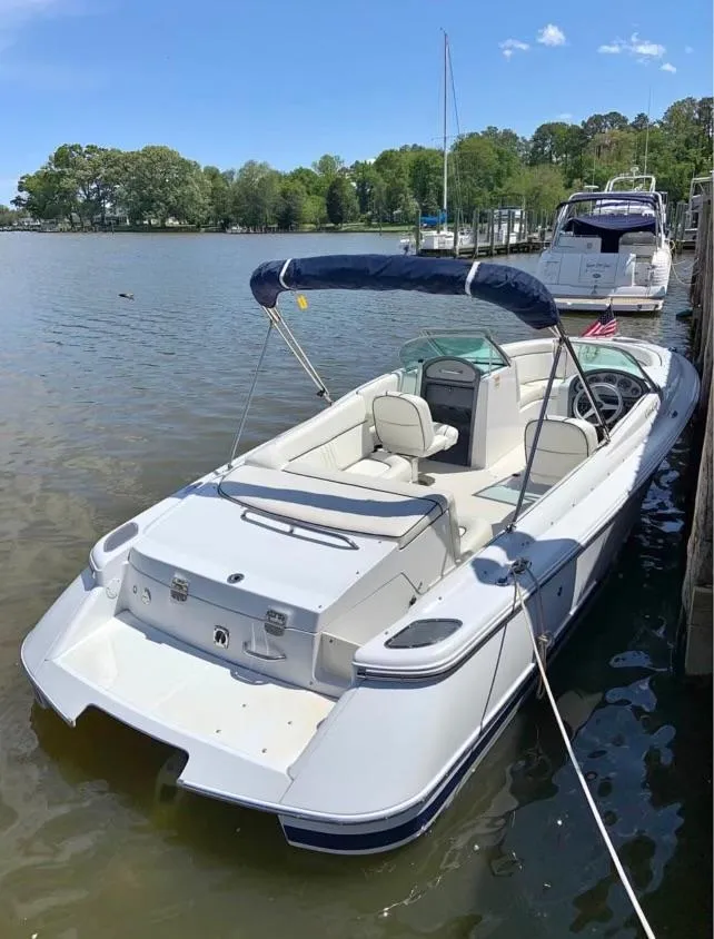 Slide: The Image of 2001 Chris-Craft Launch 22 boat docked on a calm lake. - 5