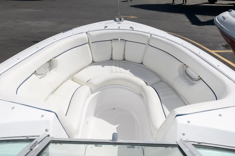 Slide: The Image of 2001 Chris-Craft Launch 22 boat with white cushioned seating in the bow area. - 8