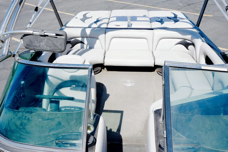 Slide: The Image of 2007 Calabria PVO-V2 boat interior with white seating and steering wheel. - 11