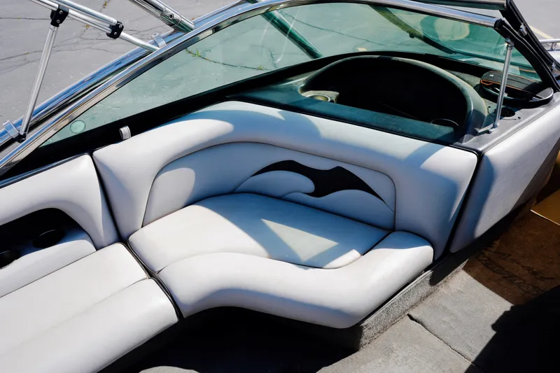 Slide: The Image of Interior of a 2007 Calabria PVO-V2 boat with white seating and steering area. - 15