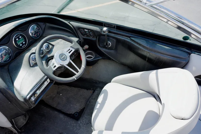 Slide: The Image of Interior of a 2007 Calabria PVO-V2 boat, featuring steering wheel and dashboard controls. - 7