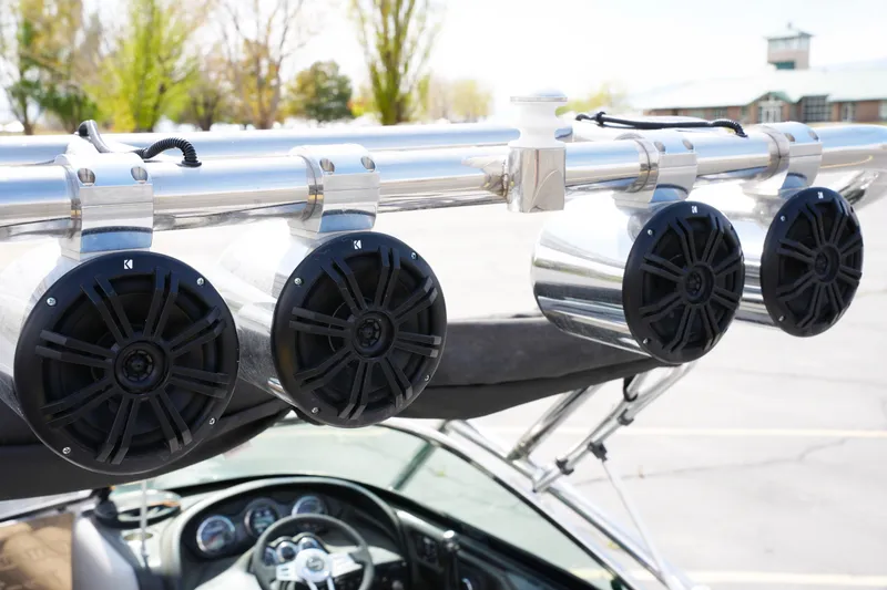 Slide: The Image of Four black speakers mounted on a 2007 Calabria PVO-V2 boat's metal frame. - 9