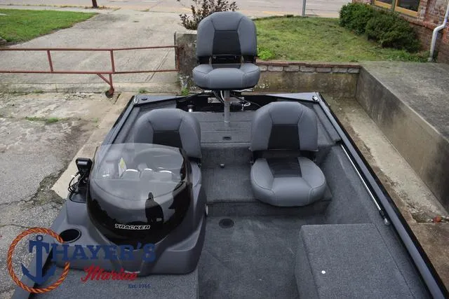 Slide: The Image of 2024 Tracker Pro 170 fishing boat interior with seating and console. - 19