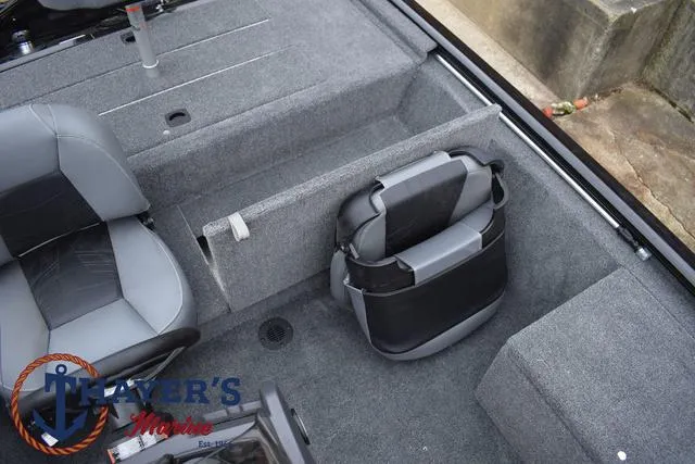 Slide: The Image of 2024 Tracker Pro 170 boat interior with gray seating and storage compartments. - 21